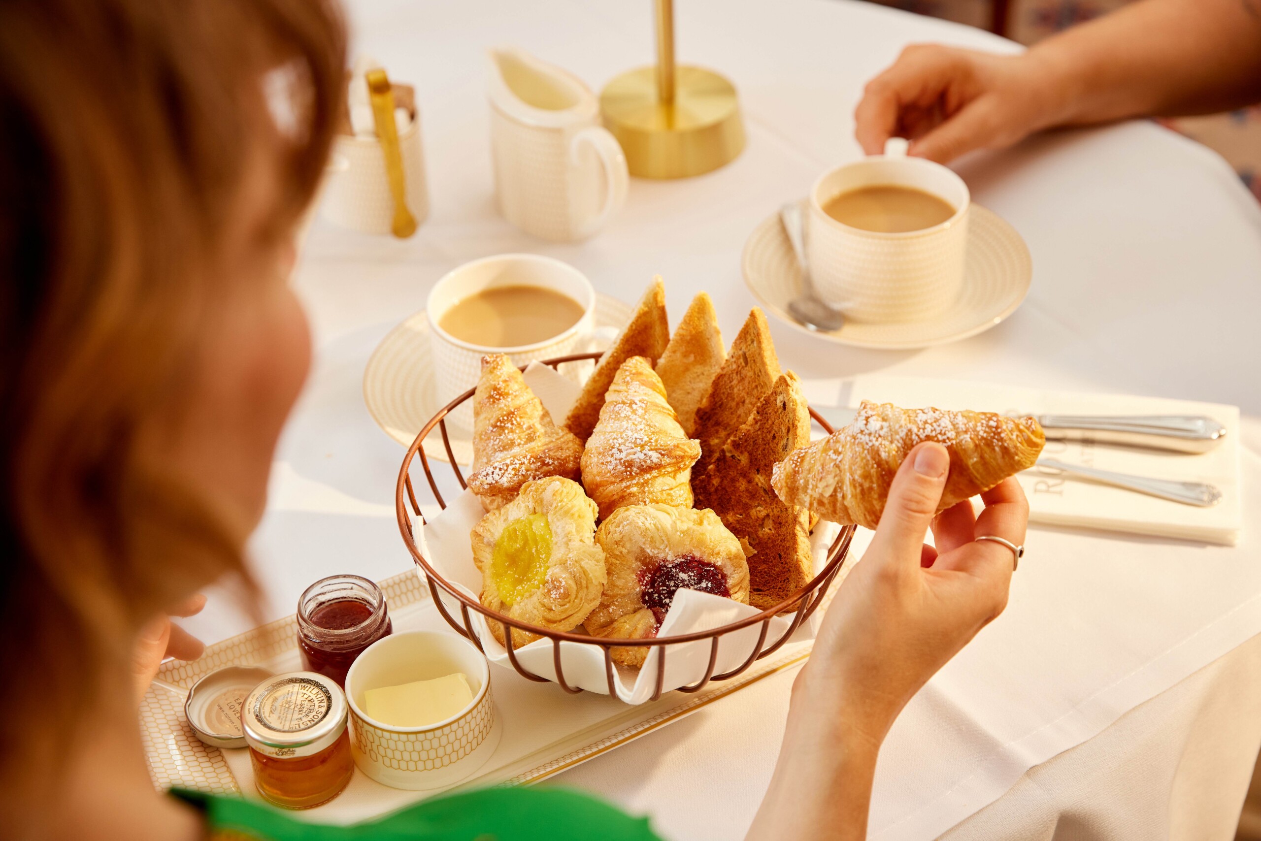 Guests enjoy a baker's basket in the Pump Room