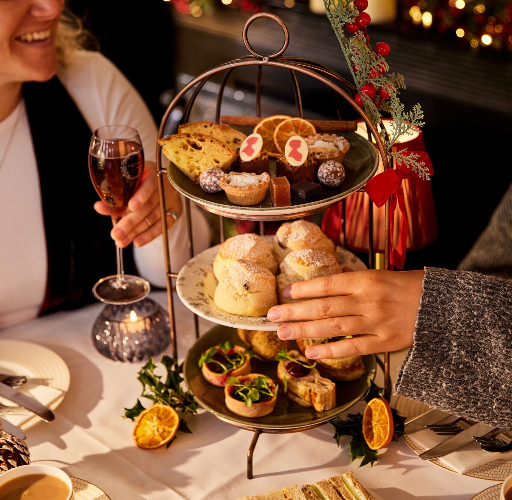 Friends enjoy a Christmas Afternoon Tea menu in the Pump Room